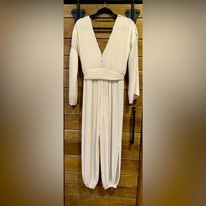 Miss los angles long sleeve cream jumpsuit in xsmall
